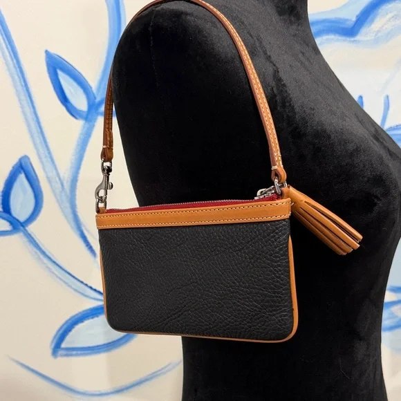 Dooney & Bourke Black and Tan Pebbled Leather Wristlet with Tassel - Picture 2 of 5